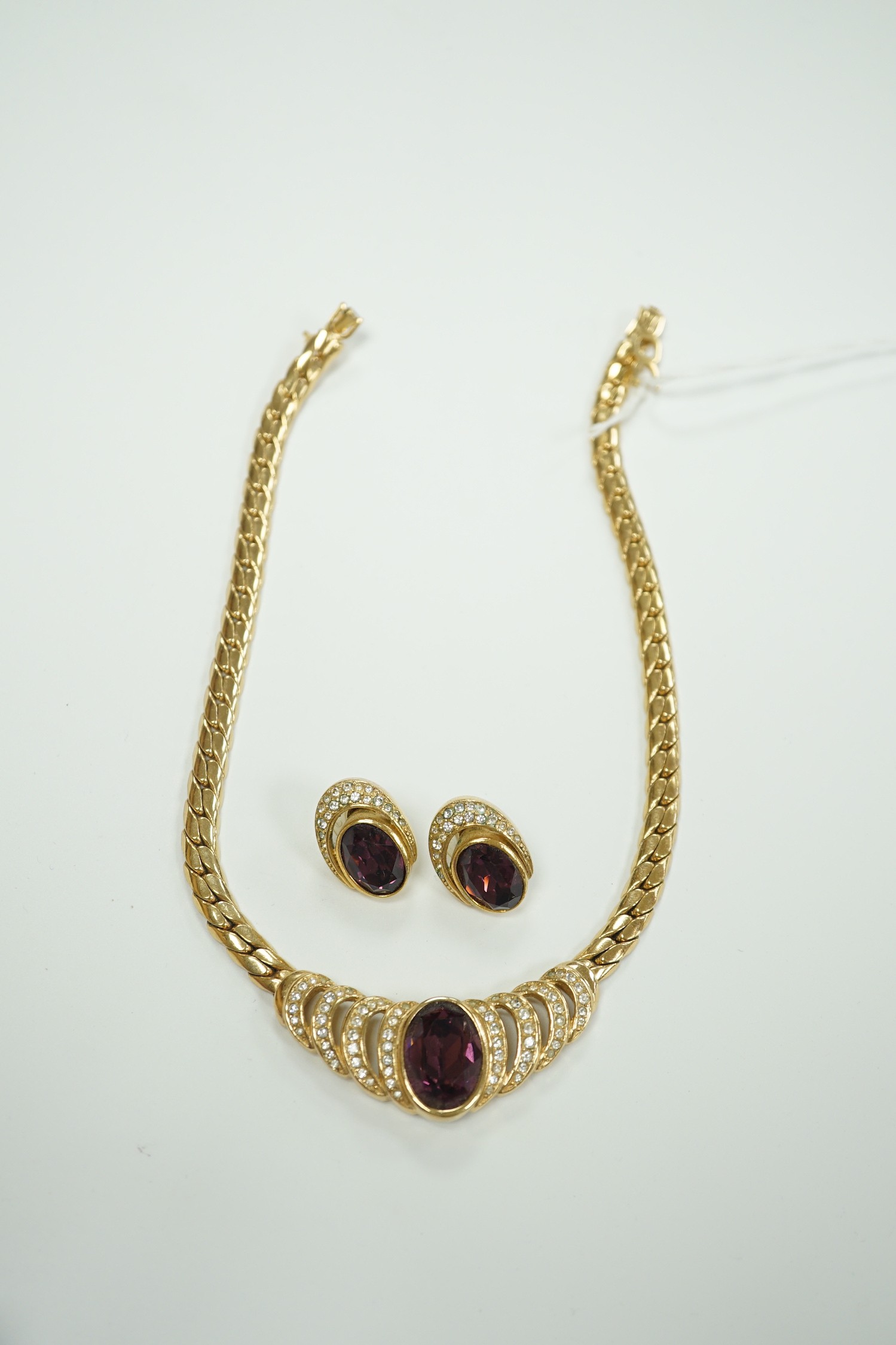 A Christian Dior gilt metal and two colour paste set costume necklace, 36cm and a pair of matching earrings.